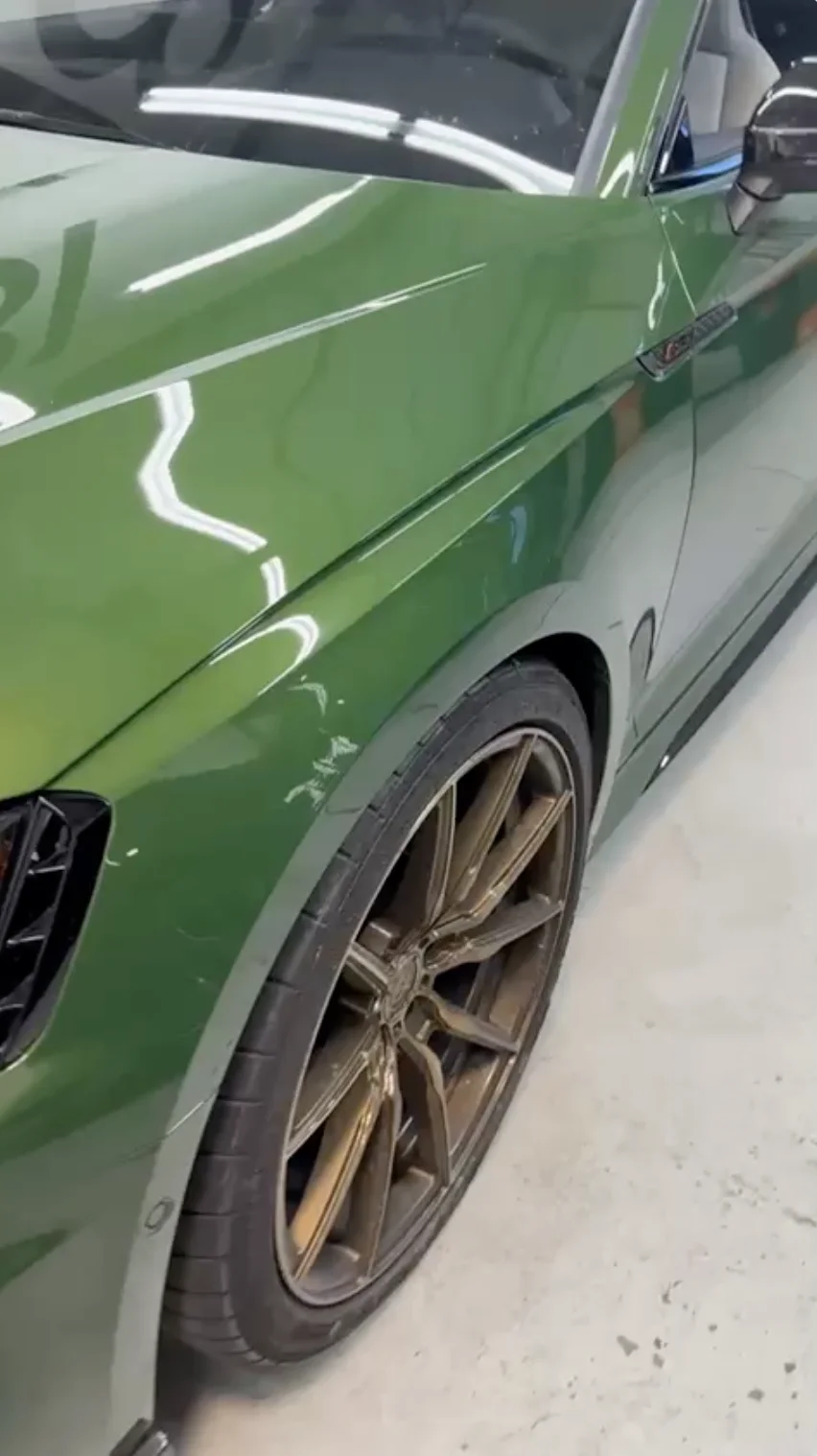 After — green car fender repaired